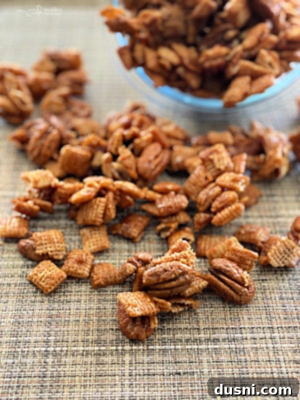 Front view of golden caramel pecan clusters artfully arranged on a light surface.