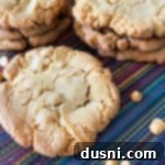 Golden Butterscotch Giants 6 Top-down view of a large, perfectly baked butterscotch cookie, golden brown with visible butterscotch chips. Ideal for a chewy, sweet fall treat.