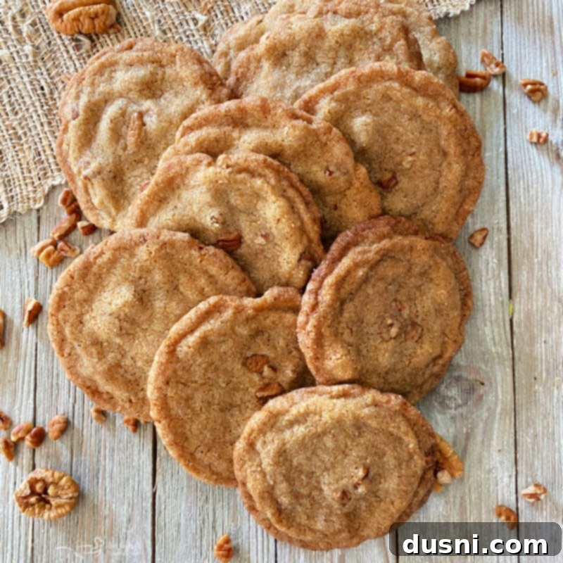 one group of pecan cookies on surface with pecans