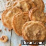 Pecan Butter Cookies lined up on a wood table