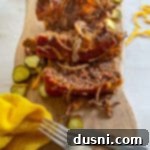 slices of cheeseburger meatloaf on wood