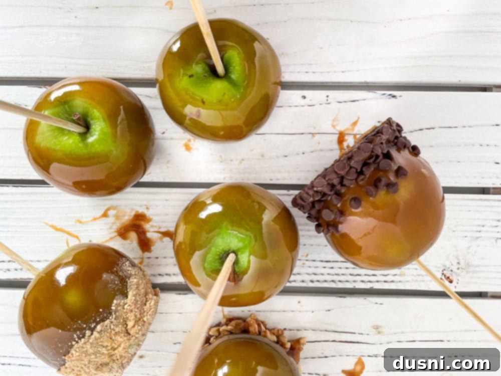 Crafting Golden Caramel Apple Treats 11 A selection of decorated homemade caramel apples with various toppings