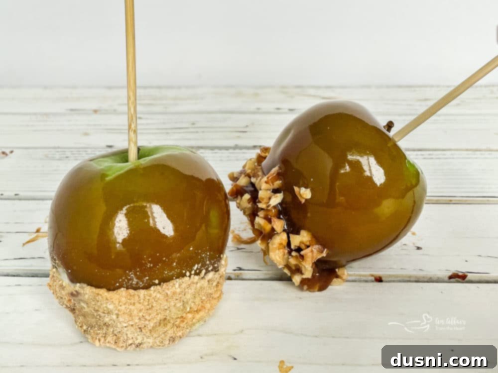 Crafting Golden Caramel Apple Treats 3 Two homemade caramel apples with sprinkles and chocolate drizzle