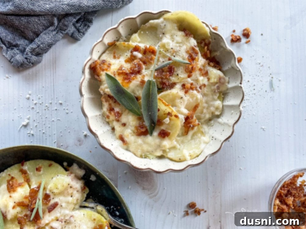 two bowls of the best potatoes au gratin recipe from scratch topped with sage and bacon