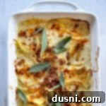 dish with baked potatoes au gratin with melted cheese and crispy bacon