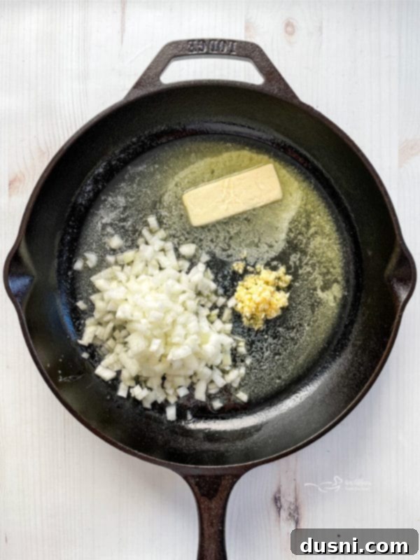 melting butter in skillet with onion and garlic