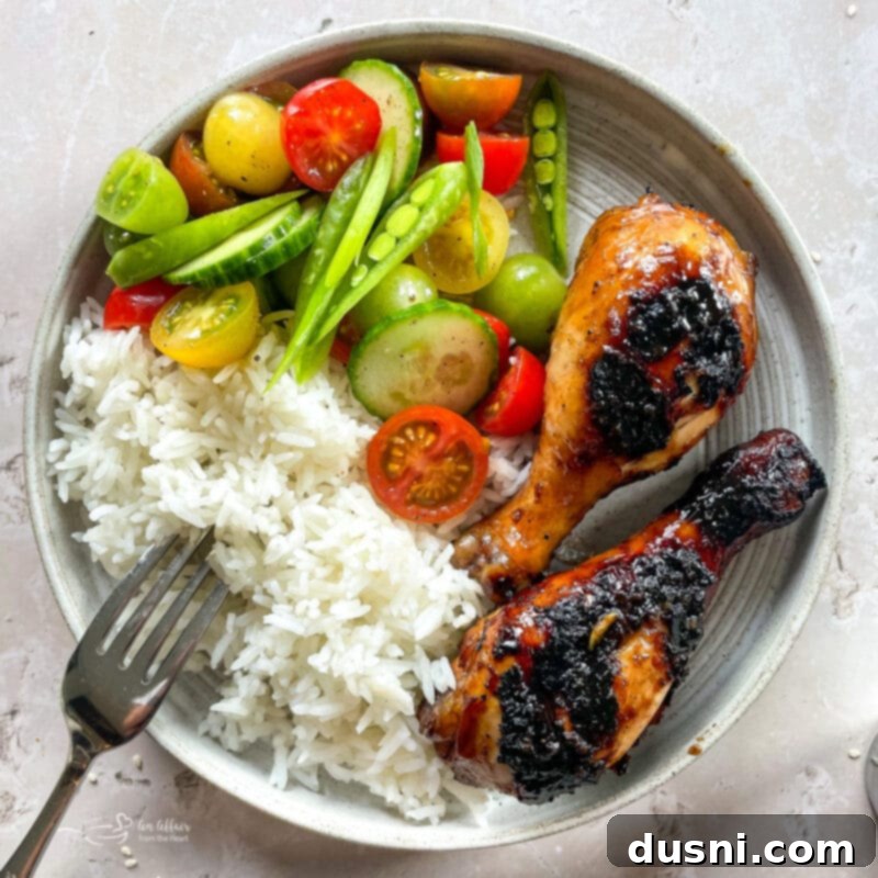 Sticky Sweet Grilled Chicken 3 Close up of Sweet and Sticky Grilled Chicken drumsticks on a grill