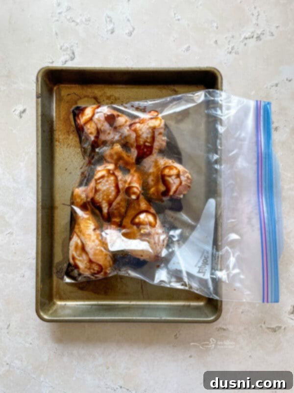 Sticky Sweet Grilled Chicken 8 Ziploc bag with chicken and marinade being sealed