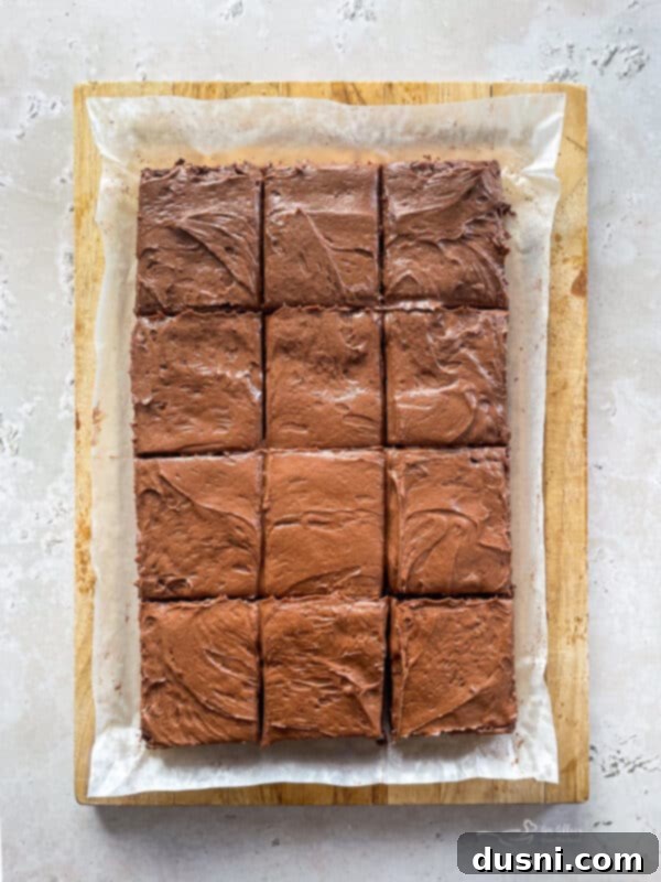 Spreading frosting on brownies