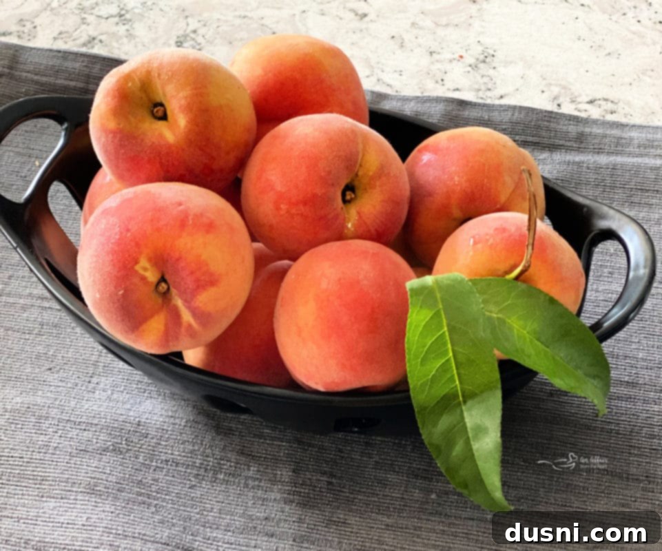 Golden Crumb Spiced Peach Pie 3 Pile of fresh, ripe peaches ready for baking.