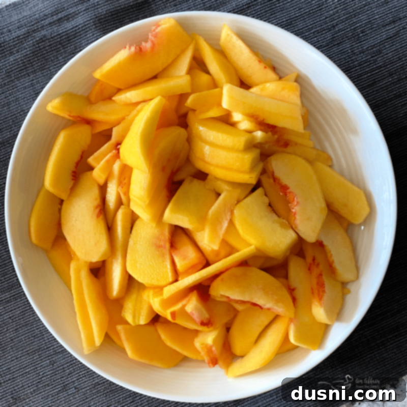 Golden Crumb Spiced Peach Pie 6 Fresh peaches being peeled and sliced on a cutting board.