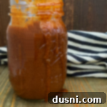 Red Enchilada sauce in a jar, ready for use
