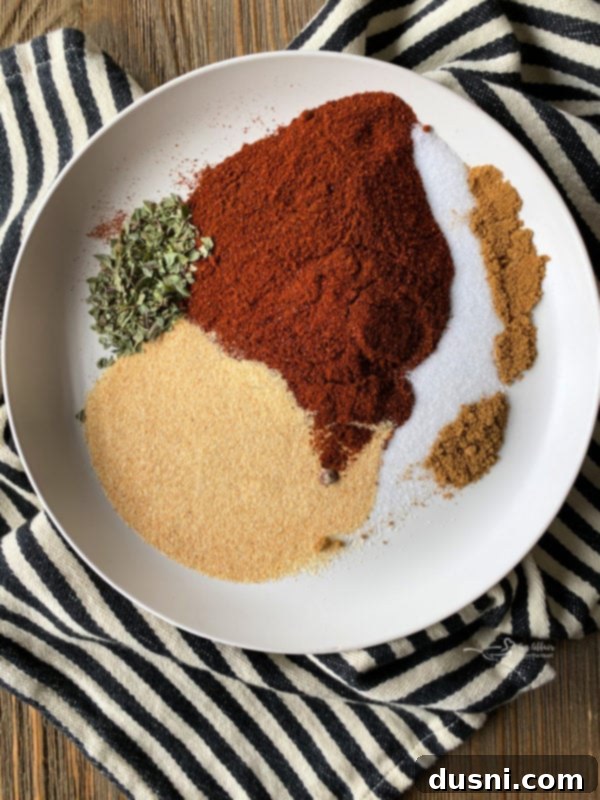 Homemade red enchilada sauce in a measuring cup