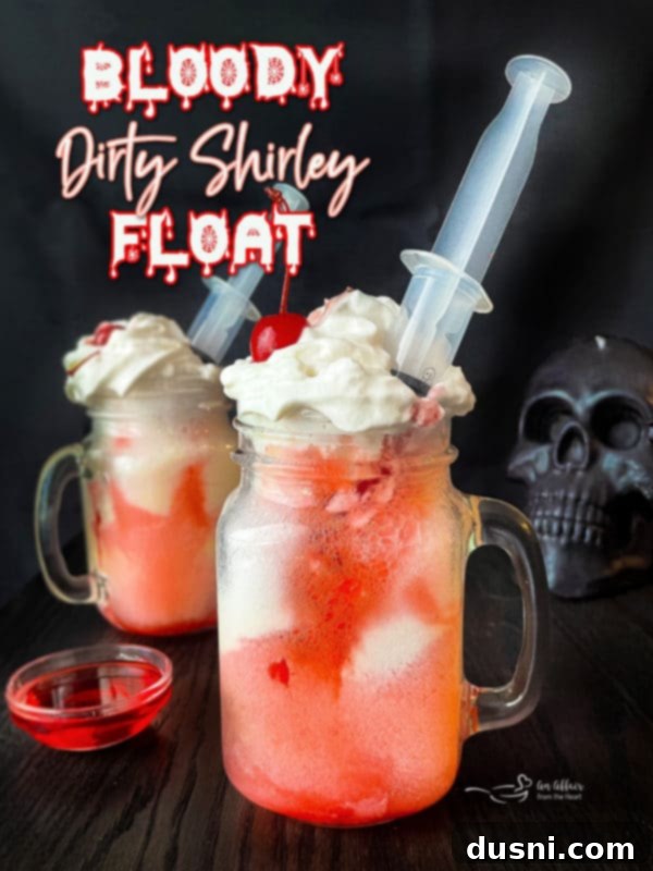 Rebel Shirley Float 13 A Bloody Dirty Shirley Float, an adult Halloween cocktail, in a glass with a cherry garnish