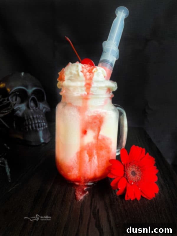 Rebel Shirley Float 5 Close-up of a Bloody Dirty Shirley Float with a grenadine-filled syringe inserted