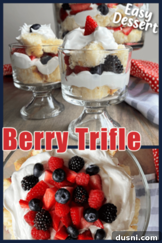 A Berry Trifle in a clear glass bowl, artfully arranged with layers of cake, cream, and fresh berries.
