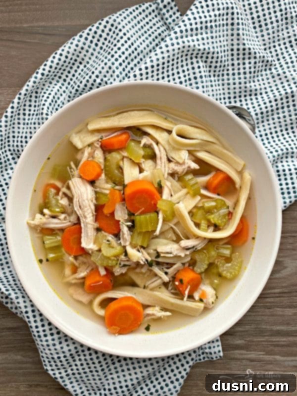 Soul-Soothing Chicken Noodle Soup 17 Two sweet dogs, Gabby and Sully, a golden retriever and a black lab mix, sitting patiently.