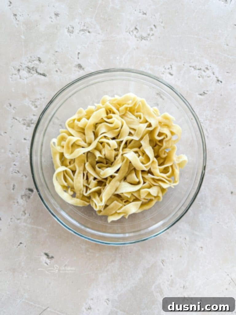 Soul-Soothing Chicken Noodle Soup 9 Close-up of freshly made homemade egg noodles, uncooked and ready to be boiled for chicken noodle soup.