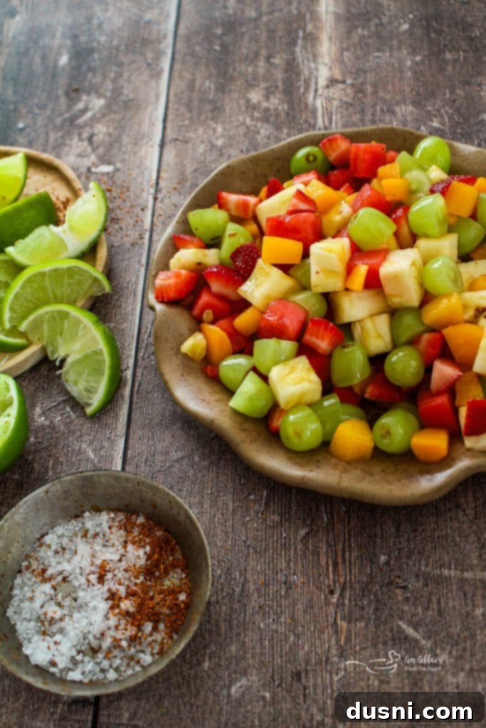 Colorful Margarita Fruit Salad in a large glass bowl