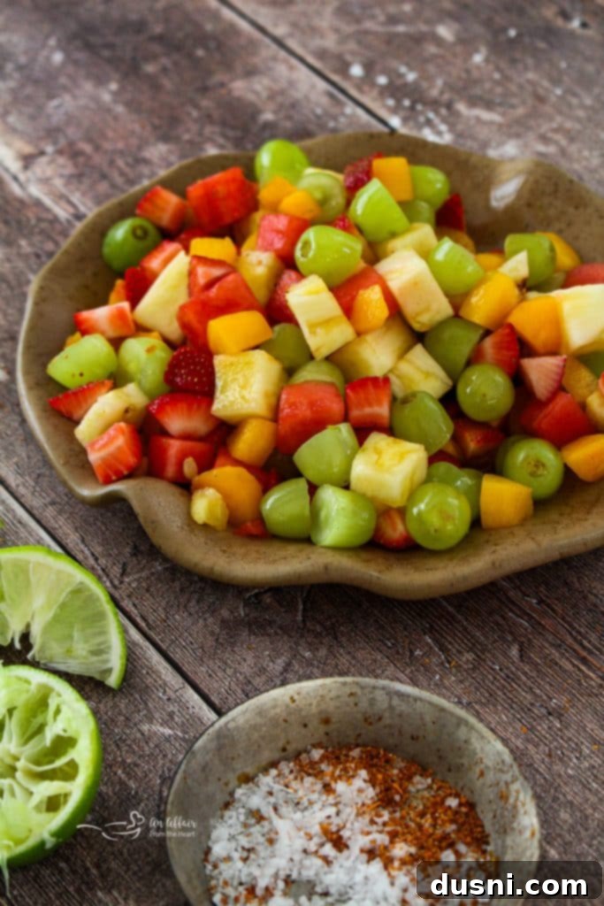A close-up of Margarita Fruit Salad with various fruits