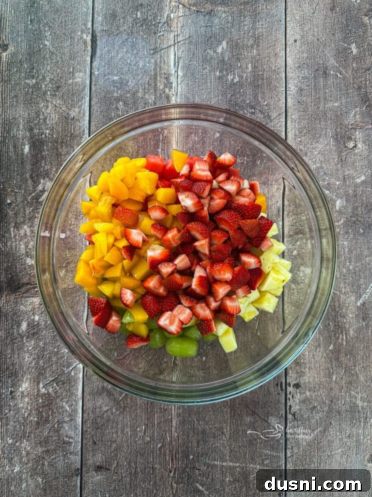 Freshly cut fruit in a large mixing bowl
