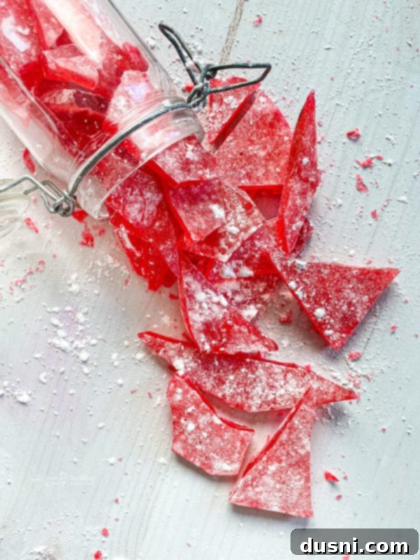 Homemade Cinnamon Rock Candy Recipe Video Tutorial 2 cinnamon rock candy spilling out of container