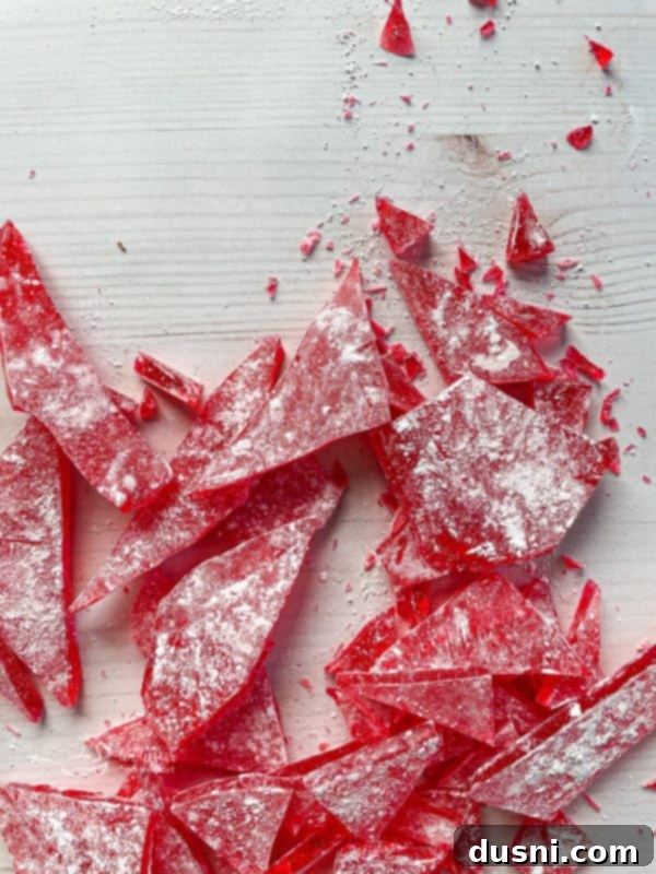 Old-Fashioned Cinnamon Rock Candy top view of pieces of cinnamon rock candy with powdered sugar