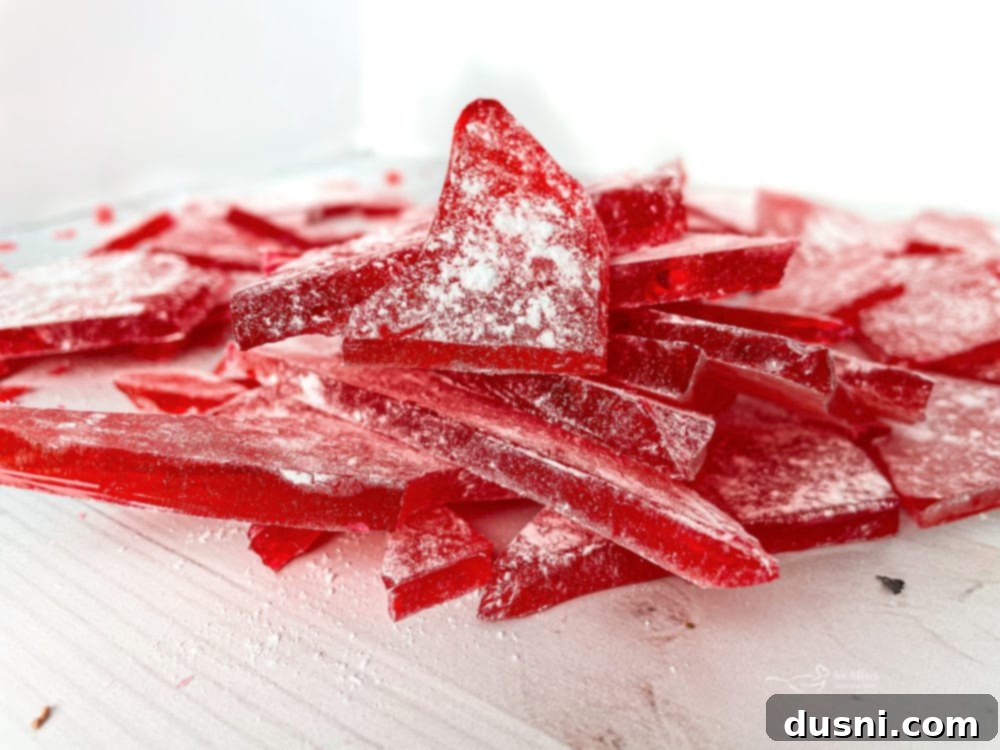 Cinnamon Candy broken pieces of cinnamon rock candy on white surface