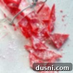 Homemade Cinnamon Rock Candy Recipe Video Tutorial 11 cinnamon rock candy broken into tiny pieces in a jar