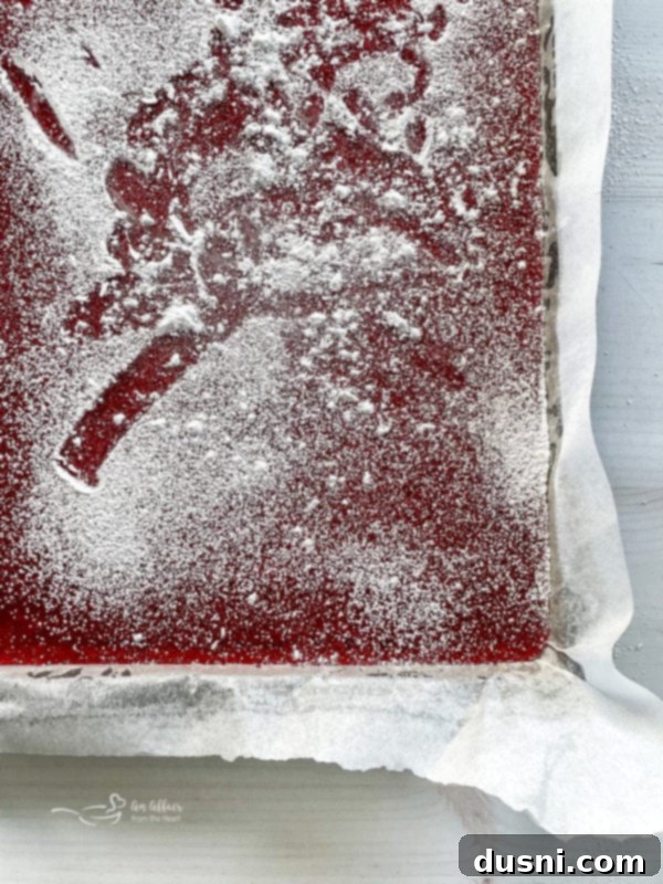 Cinnamon Candy top view of cinnamon rock candy in baking sheet with powdered sugar