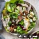 Crisp Apple Grilled Chicken Waldorf 4 one bowl of salad with broccoli, lettuce, chicken, grapes, walnuts, pears, dressing