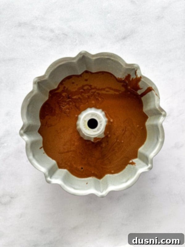 Velvet Espresso Chocolate Torte 8 Chocolate pieces being folded into cake batter.