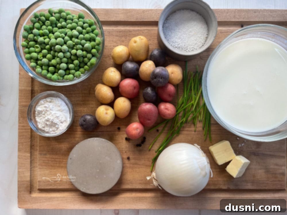 Collection of fresh ingredients for creamed potatoes and peas: peas, potatoes, salt, milk, onion, butter, flour, chives.