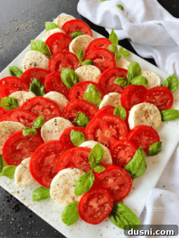 Caprese salad on a white square serving plate