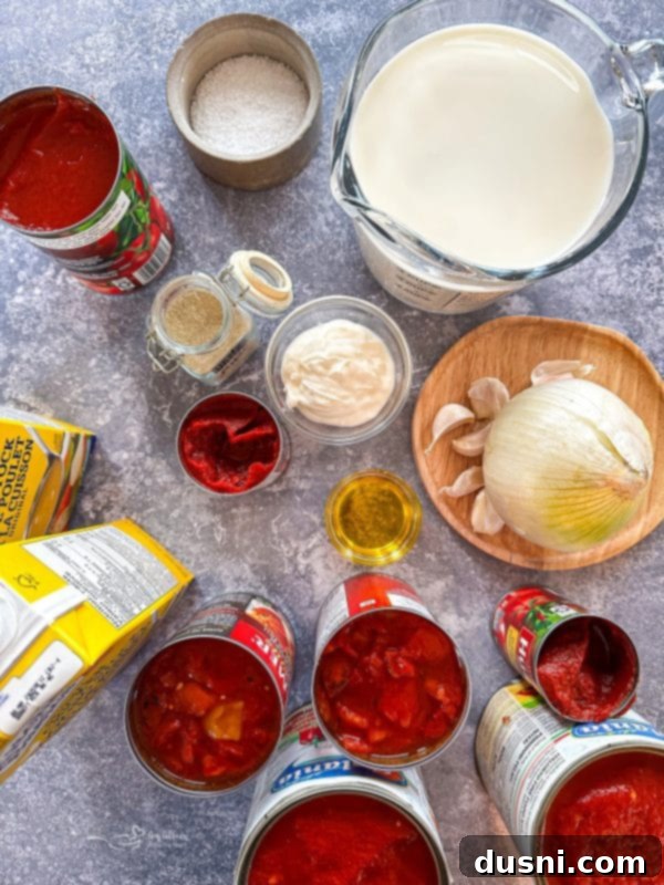 A large pot of fire-roasted tomato soup simmering on the stove.