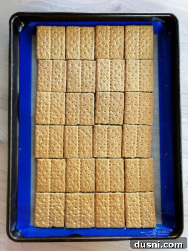 Gooey S'mores Cookie Bars 6 Graham crackers laid out on a baking sheet