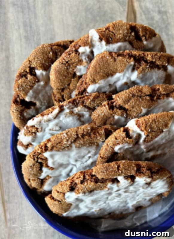 Ginger Crinkle Cookies A beautiful bowl of perfectly iced molasses cookies, showcasing their soft texture and signature crinkles, ready to be enjoyed.