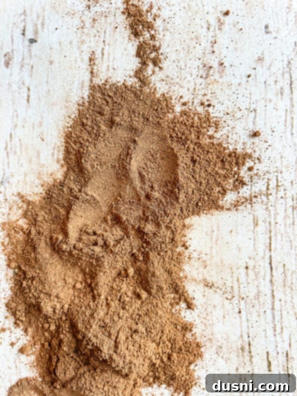 Velvet Pumpkin White Russian 4 A small bowl of homemade pumpkin pie spice, freshly prepared and ready for use in various fall recipes.