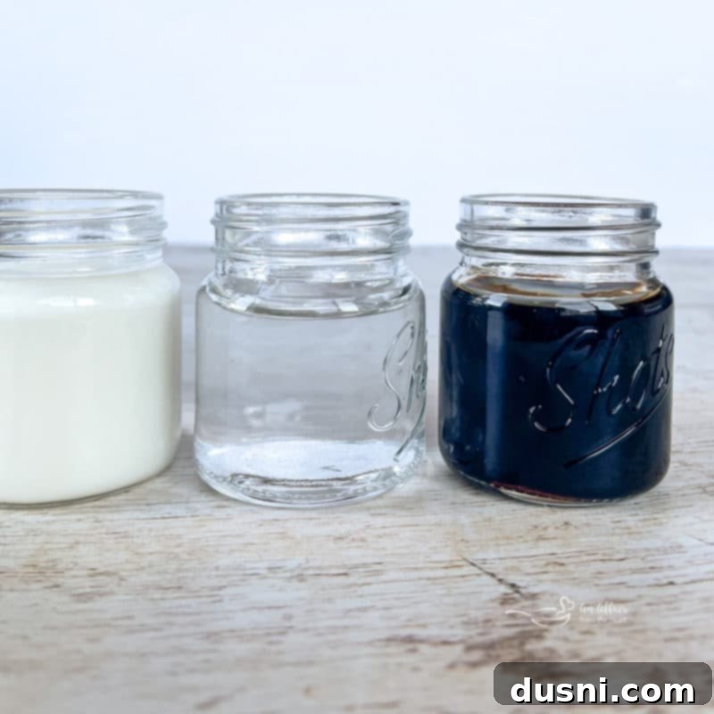 Velvet Pumpkin White Russian 5 Close-up shot of Kahlua, vodka, and pumpkin spice creamer bottles, highlighting the key ingredients for a Pumpkin White Russian cocktail.