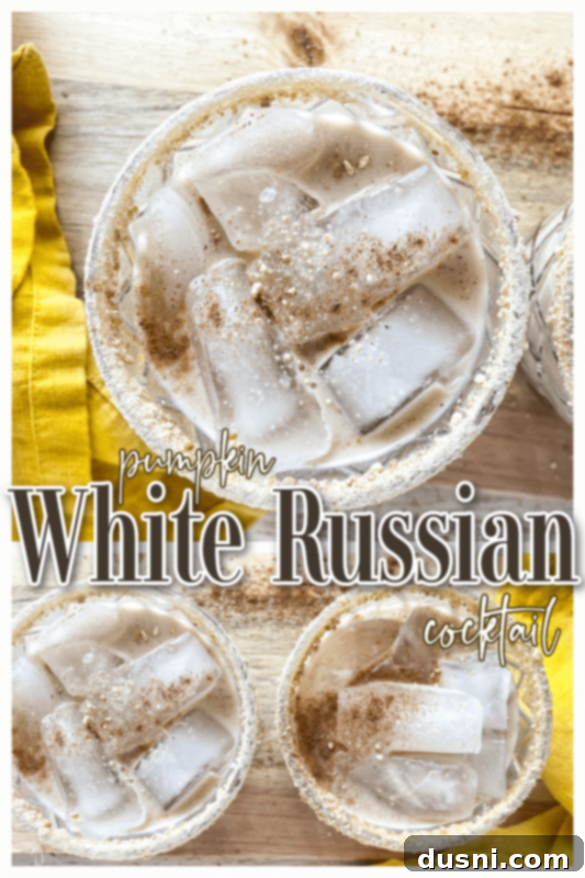 Velvet Pumpkin White Russian 10 A beautifully presented Pumpkin White Russian Cocktail with a creamy top and a festive garnish, set against a warm backdrop.