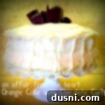 Side view of Orange Layer cake onn a white cake platter with text "orange cake with chocolate curls"