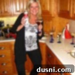 Michaela with a martini in her hand