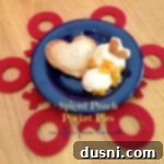 Spiced Peach Love Pockets 2 spiced peach pocket pies with vanilla ice cream on a blue plate