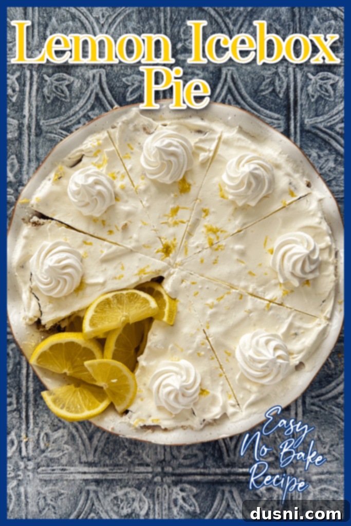 Effortless Lemon Dream Pie 17 A top-down view of a Lemon Icebox Pie with a wedge removed, garnished with whipped cream and lemon zest.