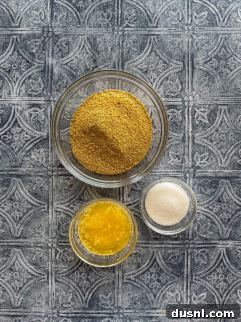 Effortless Lemon Dream Pie 6 A close-up of the ingredients for Lemon Icebox Pie: Graham cracker crumbs, butter, sugar, lemon Jell-O, Cool Whip, and a fresh lemon.