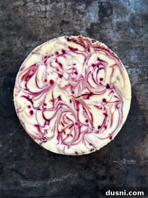 Luxurious White Chocolate Raspberry Truffle Cheesecake 16 White Chocolate Raspberry Cheesecake baking in a water bath