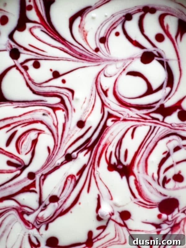 Luxurious White Chocolate Raspberry Truffle Cheesecake 6 Elegant slice of white chocolate raspberry cheesecake