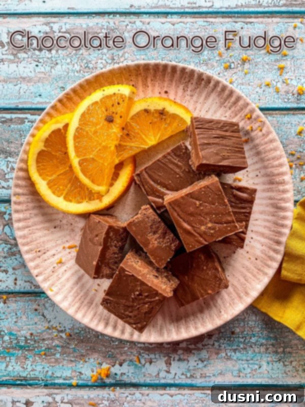 Chocolate Orange Fudge top view of cubes of chocolate orange with orange slices