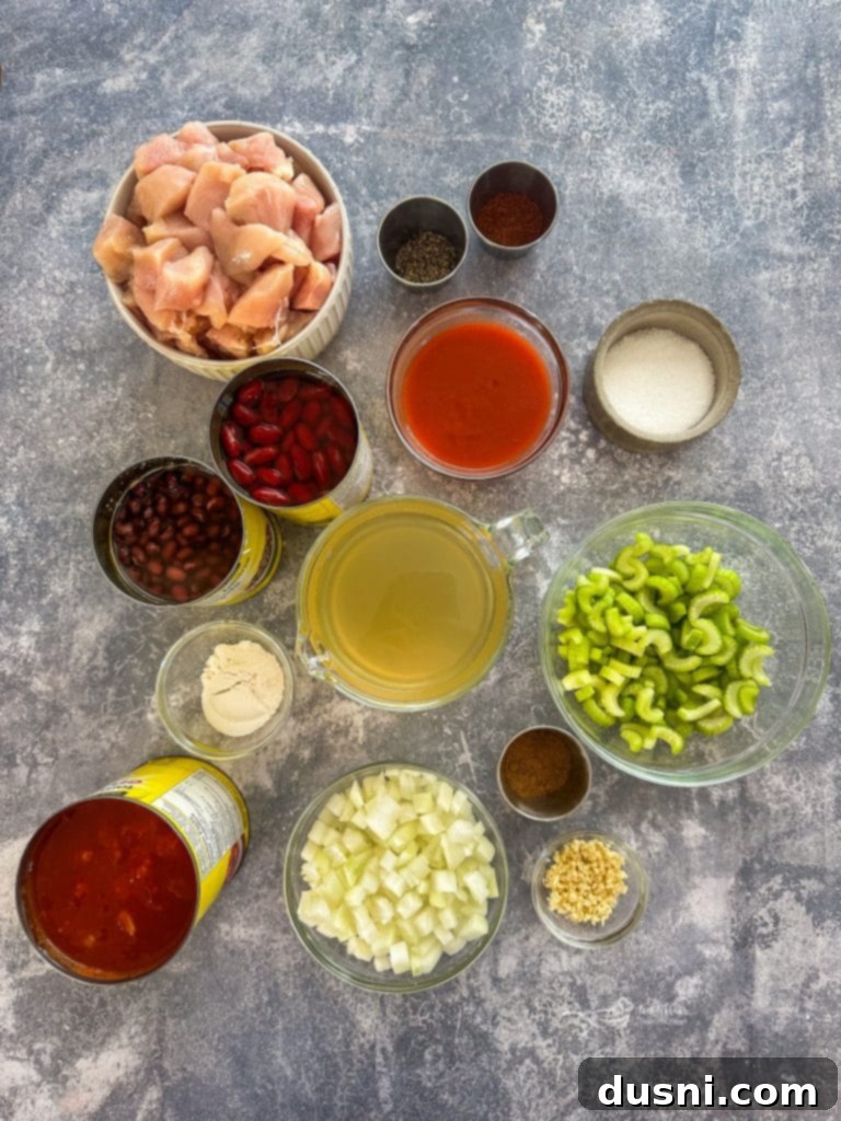Hearty Slow Cooker Buffalo Chicken Chili 5 A top-down view of Slow Cooker Buffalo Chicken Chili in a pot, ready to be served, showcasing its rich texture.