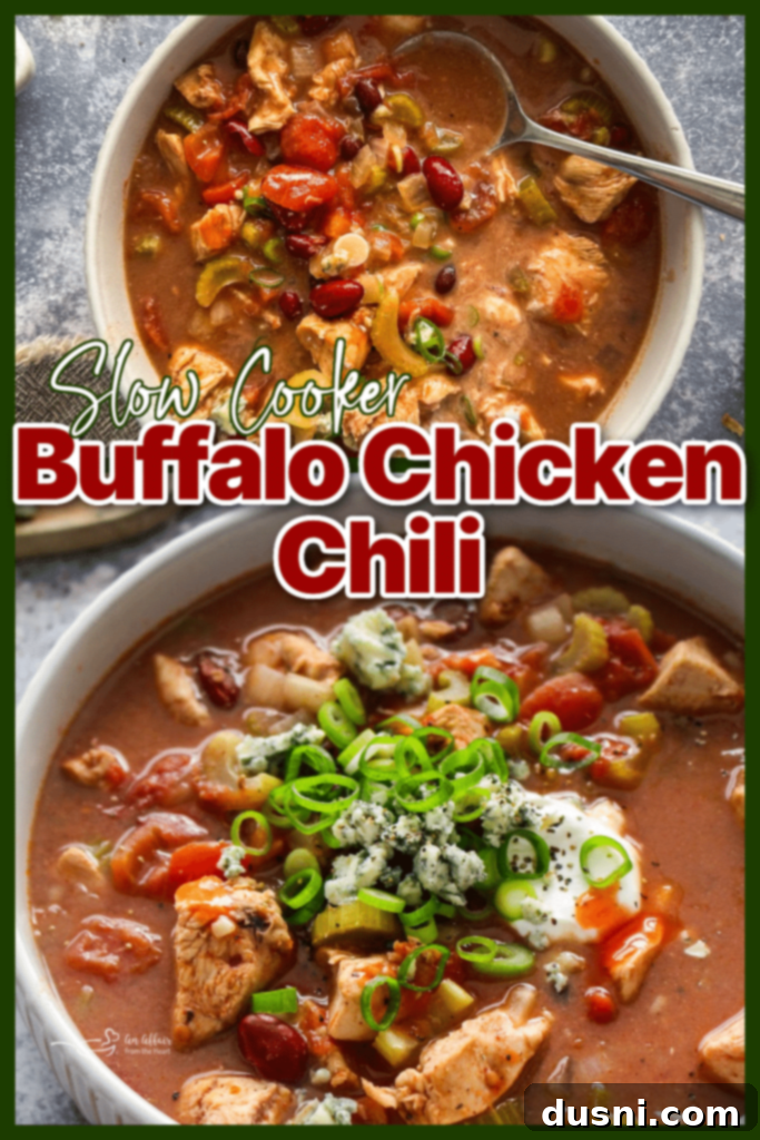 Hearty Slow Cooker Buffalo Chicken Chili 10 A bowl of Slow Cooker Buffalo Chicken Chili, garnished with blue cheese and celery, sitting next to a glass of water on a rustic table.